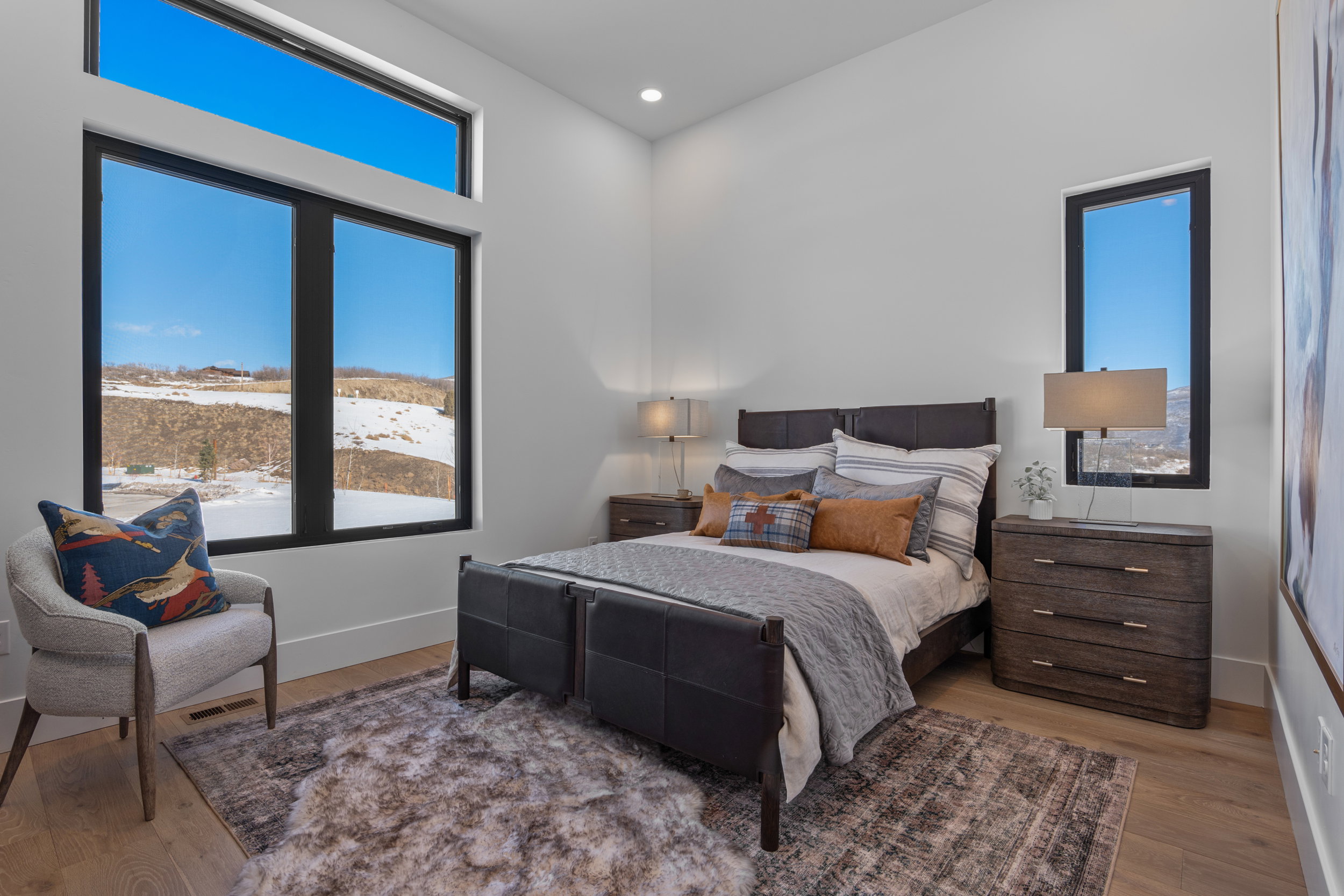 Bedroom with wood finished floors and recessed lighting
