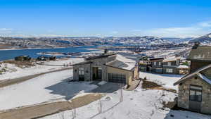 Snowy aerial view featuring a mountain view