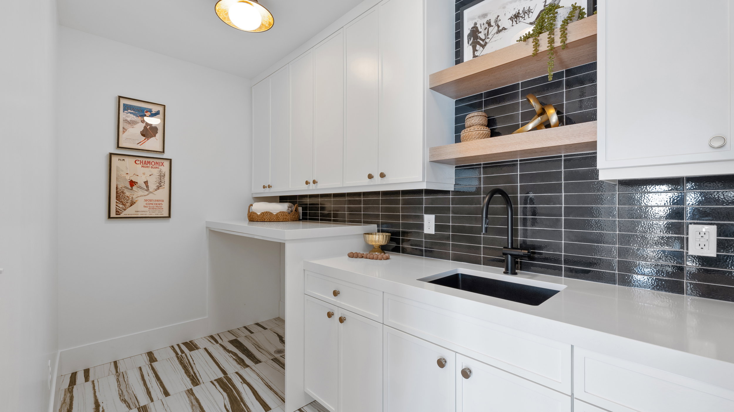 Kitchen featuring open shelves, tasteful backsplash, white cabinetry, and light stone countertops