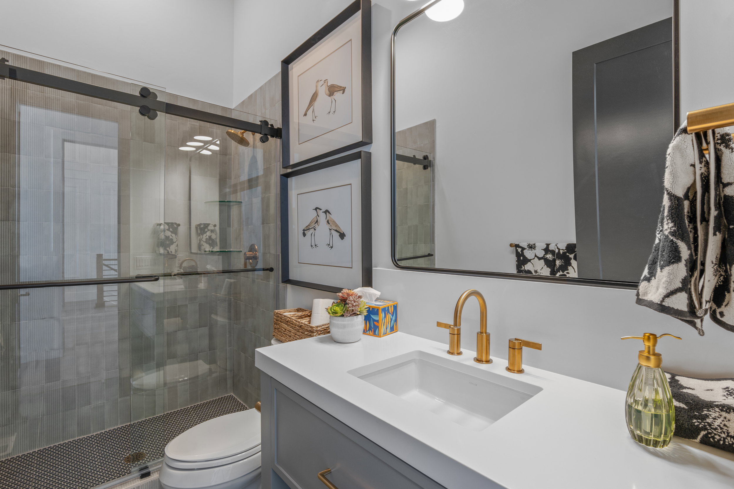 Full bathroom featuring vanity and a shower stall