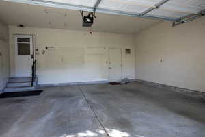 Garage featuring a garage door opener