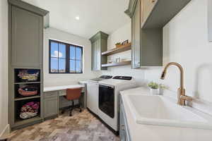 Laundry room featuring washing machine and dryer, an office area, cabinet space, and recessed lighting