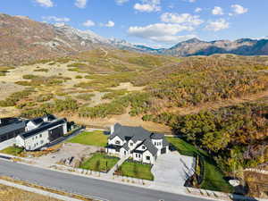View of subject property with a mountain backdrop