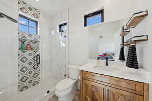 Bathroom featuring vanity and a stall shower
