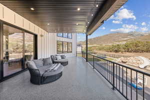 View of patio / terrace featuring an outdoor hangout area and a mountain view