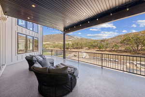 View of patio featuring a mountain view and outdoor lounge area