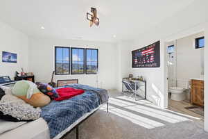 Bedroom featuring recessed lighting, light colored carpet, and light wood-type flooring