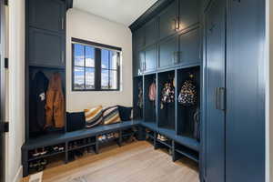 Mudroom featuring light wood finished floors