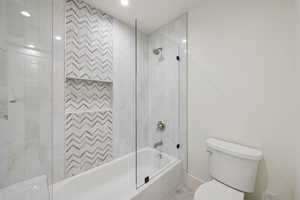 Full bath featuring shower / washtub combination and toilet