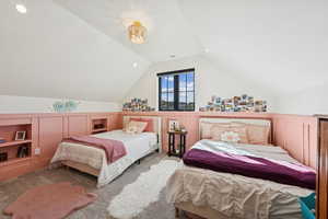 Carpeted bedroom with vaulted ceiling