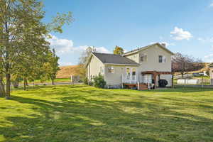 Rear view of property with a wooden deck and a chimney