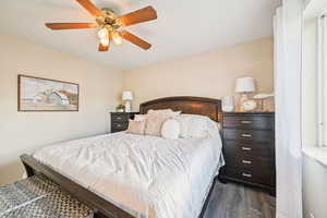 Bedroom featuring wood finished floors and ceiling fan