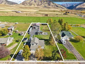 View of rural area with property boundaries highlighted and a mountain backdrop