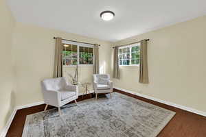 Living area with dark wood finished floors