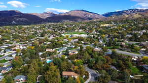 Aerial view of property's location with a mountainous background