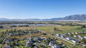 Aerial view of residential area featuring a water and mountain view
