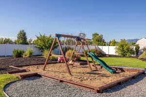 Communal playground with a fenced backyard