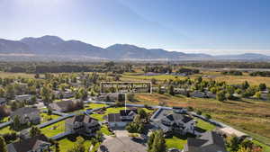 Aerial perspective of suburban area with a mountainous background