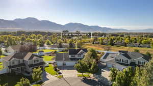 Aerial perspective of suburban area featuring a mountainous background