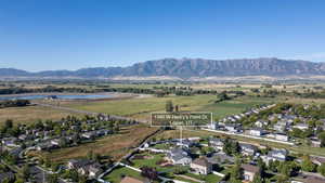 Aerial perspective of suburban area featuring a water and mountain view