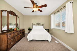 Bedroom featuring carpet and a ceiling fan