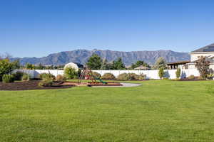View of yard featuring a playground and a mountain view