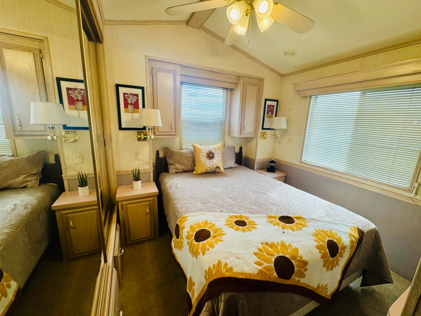 Bedroom featuring multiple windows, ceiling fan, crown molding, and carpet floors