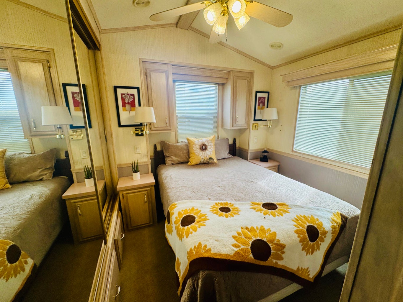 Bedroom with a closet, ceiling fan, crown molding, and dark carpet