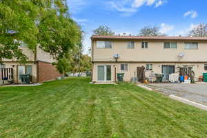 Rear view of property featuring a patio area