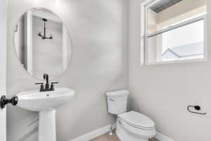 Bathroom featuring toilet and tile patterned flooring