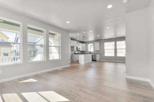 Unfurnished living room featuring recessed lighting and light wood-style flooring
