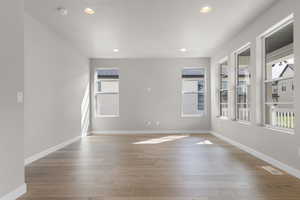 Empty room featuring recessed lighting and light wood-type flooring