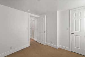 Closet for fourth bedroom and doorway out to the common area.