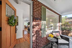 Covered front porch, custom entry door and decorative alcove to display treasures.