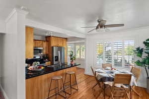 Kitchen with a breakfast bar and granite counters and a semi-formal dining area.