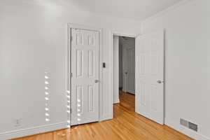 Second bedroom closet and door out to hallway.