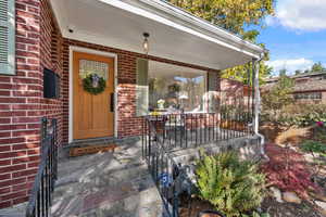 Covered front porch perfect for enjoying sunrises or people watching.