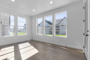 Unfurnished dining area featuring light wood-style flooring and recessed lighting