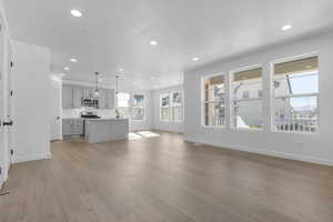 Unfurnished living room with recessed lighting and light wood-style floors
