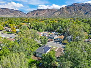 View of property location with nearby suburban area and mountains