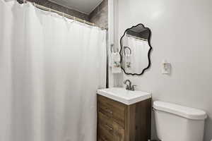 Bathroom with vanity and a shower with curtain