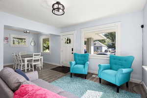 Living area featuring wood finished floors and baseboards