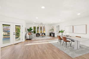 Dining area featuring recessed lighting, light wood-style flooring, and french doors