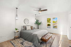 Bedroom featuring light wood-style floors and ceiling fan