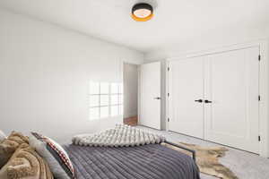 Bedroom with carpet floors and a closet