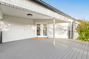Wooden deck featuring french doors