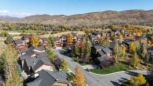 Aerial perspective of suburban area with a mountain backdrop