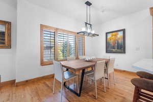 Dining room featuring light wood finished floors and baseboards