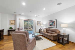 Living room featuring light wood finished floors and recessed lighting