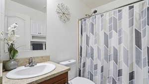 Bathroom with vanity and a shower with shower curtain